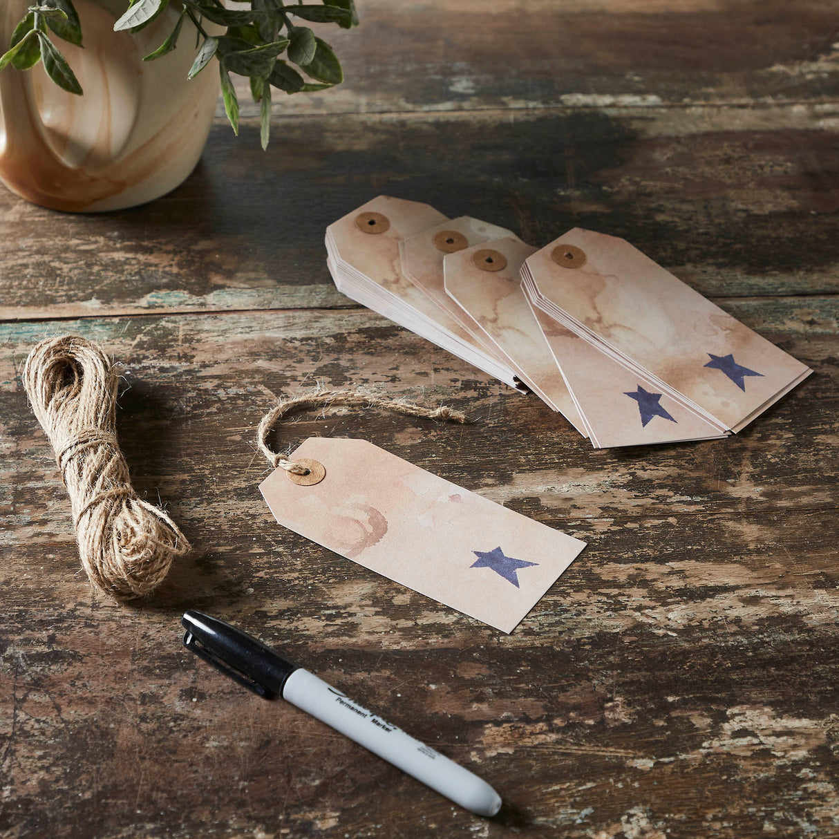 85081-Primitive-Star-Tea-Stained-Paper-Tag-Navy-4.75x2.25-w/-Twine-Set-of-50-image-1
