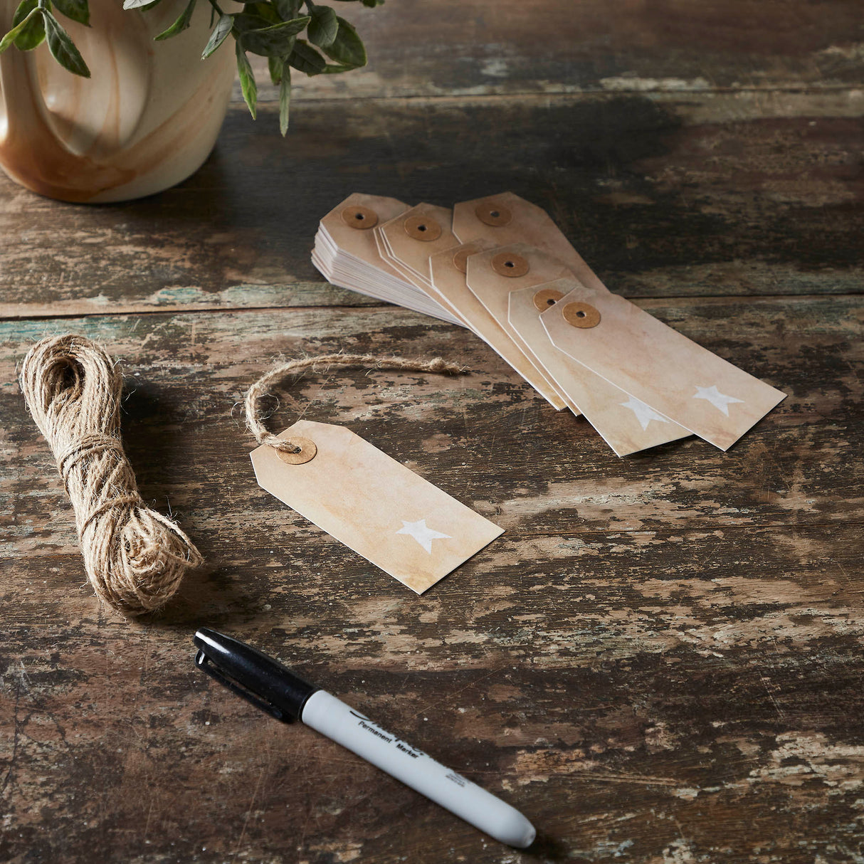 85086-Primitive-Star-Tea-Stained-Paper-Tag-Creme-3.75x1.75-w/-Twine-Set-of-50-image-1