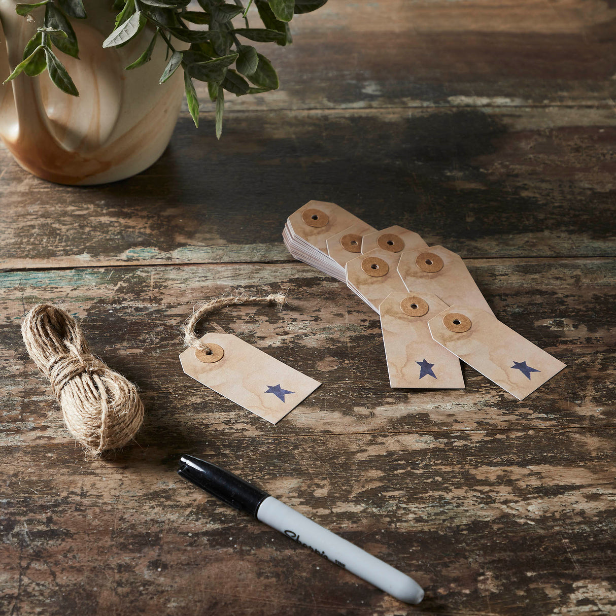 85087-Primitive-Star-Tea-Stained-Paper-Tag-Navy-2.75x1.5-w/-Twine-Set-of-50-image-1